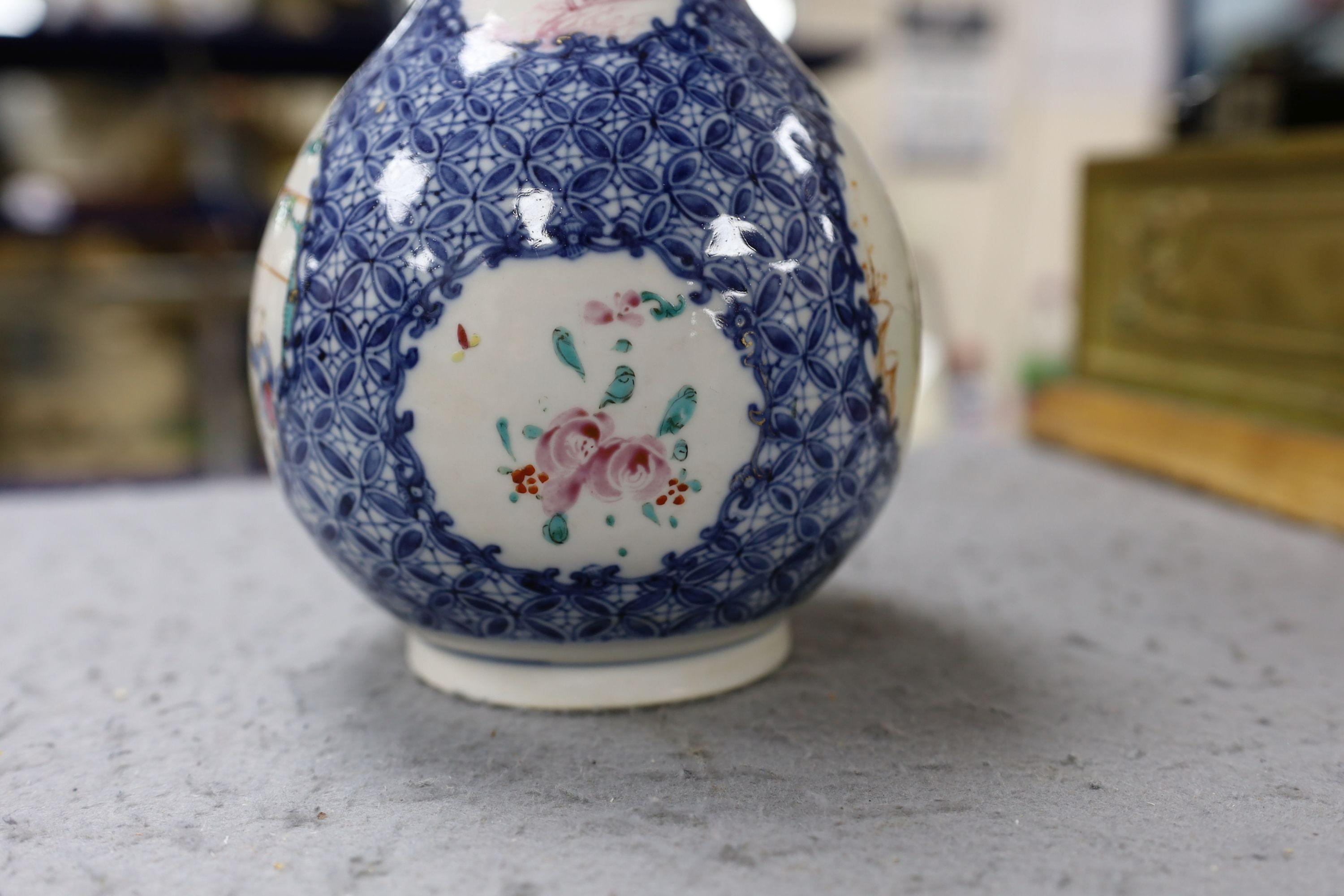 A pair Samson of Paris vases in the Chinese famille verte style and a Chinese Qianlong famille rose garlic neck vase with blue panelling motif, tallest 26cm